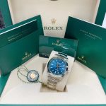 Rolex Milgauss Blue Unworn 2023 full complete set with both tags booklets manuals and warranty card.